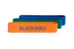 Set Blackroll Loop Band x3 — bandas naranja, verde y azul apiladas mostrando 3 niveles de resistencia