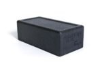 Blackroll Block visto en ángulo, bloque negro rectangular con textura antideslizante y logo BLACKROLL